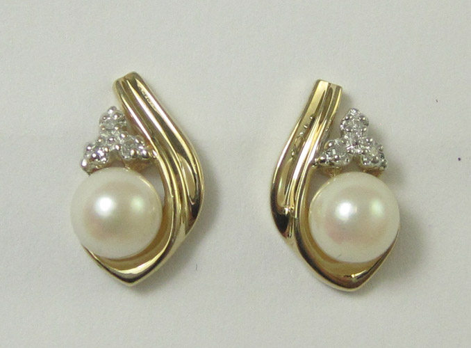 Appraisal: A PAIR OF PEARL DIAMOND AND TEN KARAT GOLD EARRINGS