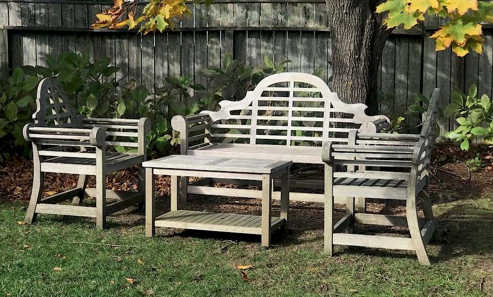 Appraisal: Teak Wood Camelback Settee Two Armchairs and Two-tier Coffee Table