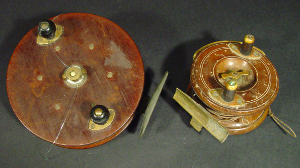 Appraisal: Two mahogany fishing reels both with ebonised and brass fittings