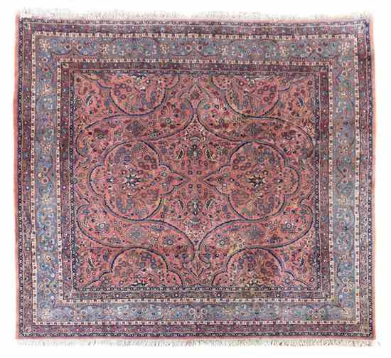 Appraisal: A Persian Wool Rug having allover stylized foliate decoration on