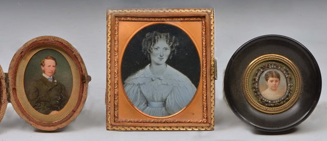 Appraisal: Three Victorian over-painted photographs to include one of a gentleman