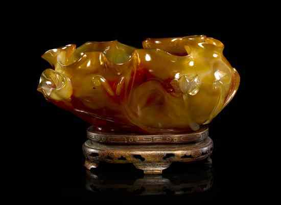 Appraisal: A Chinese Agate Brushwasher in the form of a curled