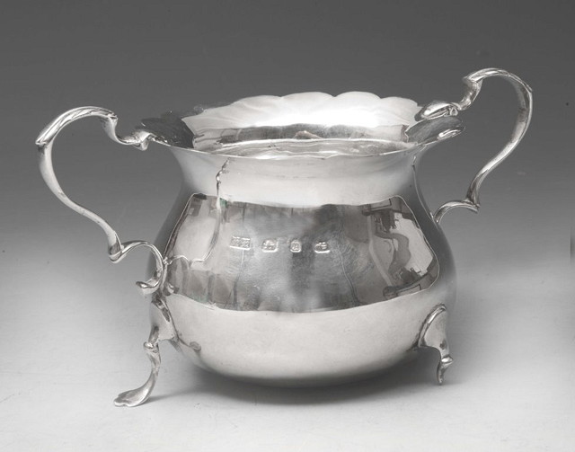 Appraisal: AN OPEN SILVER SUGAR BASIN of baluster form with shaped