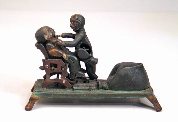 Appraisal: A cast-iron dentist mechanical bank