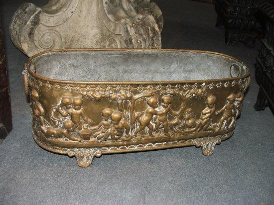 Appraisal: AN EMBOSSED BRASS PLANTER with metal liner and ring handles