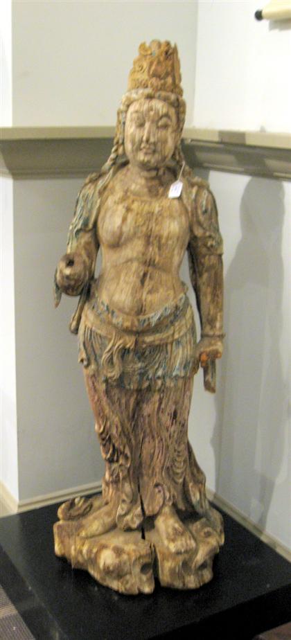 Appraisal: Large Chinese polychrome wood QuanyinCarved standing polychrome highlight to body