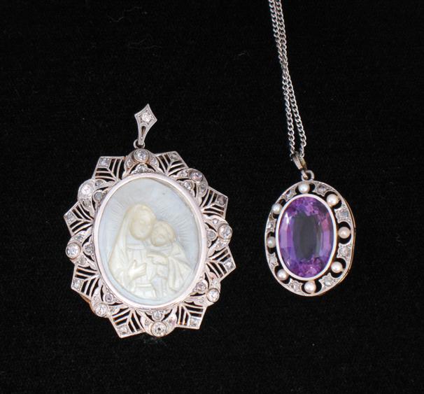 Appraisal: A LARGE AMETHYST AND SEED PEARL PENDANT the large central