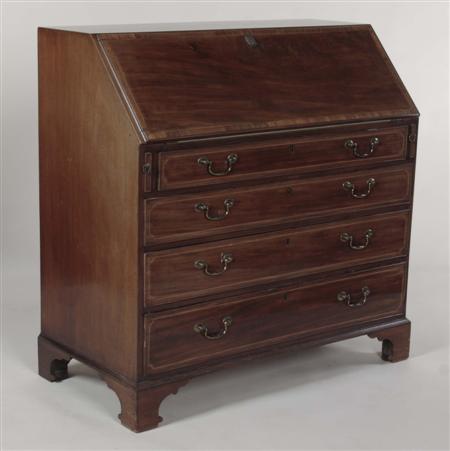 Appraisal: A George III mahogany bureau the crossbanded fall-flap enclosing a