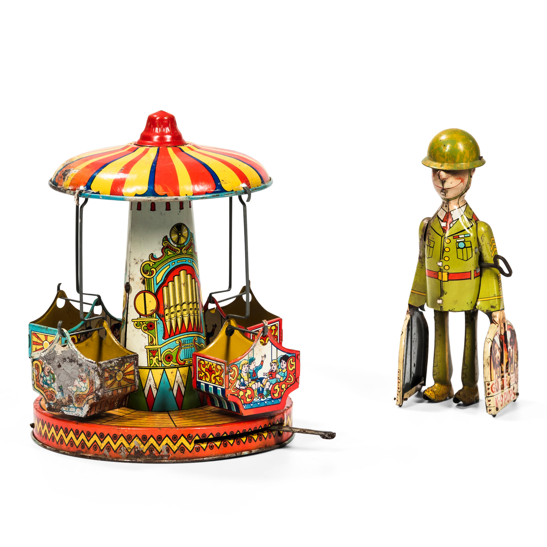 Appraisal: TWO CHROMOLITHOGRAPH TIN TOYS a merry-go-round toy and a G