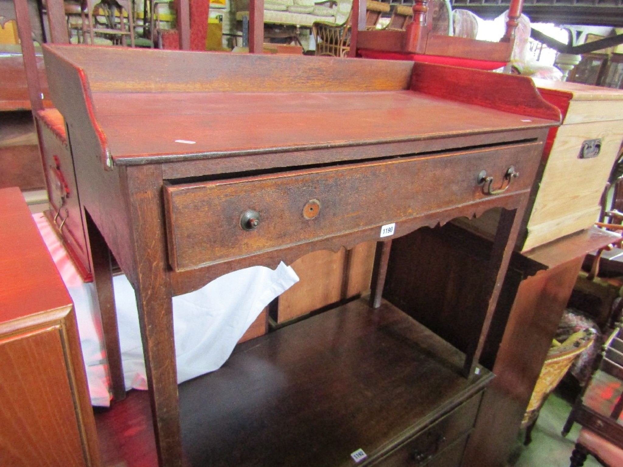 Appraisal: A Georgian oak washstand side table with raised shallow three