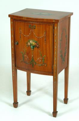 Appraisal: AN EDWARDIAN SATINWOOD BEDSIDE CUPBOARD of bowed form with ebony