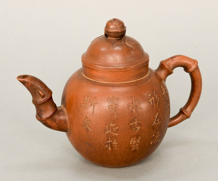 Appraisal: Brown pottery Yixing teapot China of bulbous shape with bamboo-form