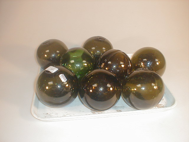 Appraisal: A group of eight green glass fisherman's floats