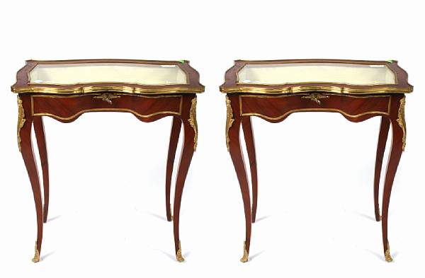 Appraisal: A pair of Louis XV style display vitrine tables with