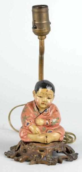 Appraisal: Cast Iron Asian Boy Lamp Base Description Made by Hubley