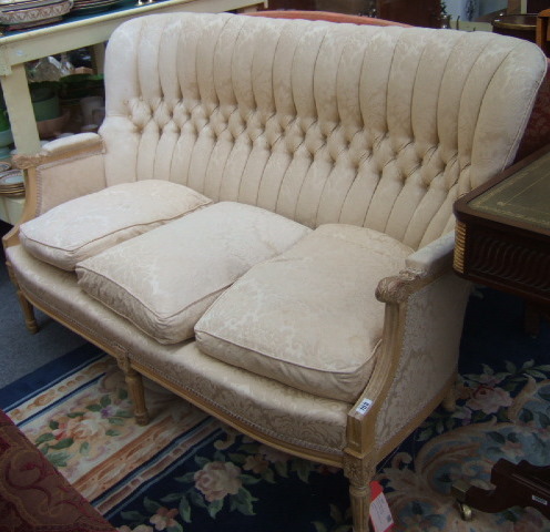 Appraisal: A beech framed canape with cream upholstery and acanthus scroll