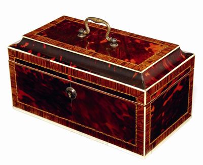 Appraisal: A George III tortoiseshell tea caddy with kingwood banding chevron