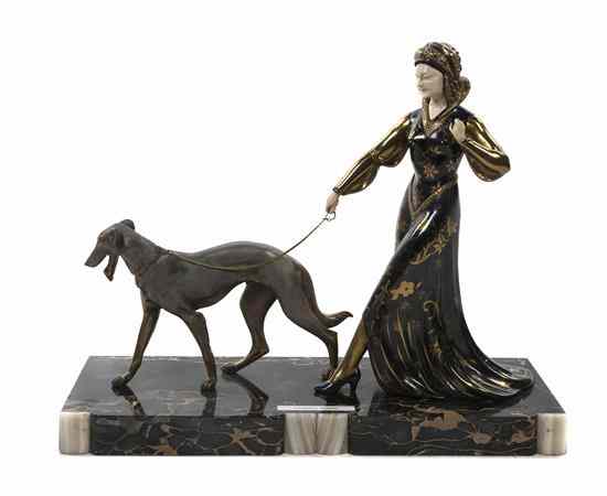 Appraisal: A Cast Metal and Gilt Enameled Figural Group depicting an