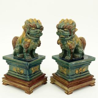 Appraisal: Pair Chinese Sancai Glaze Pottery Foo Dog Figures on Wood