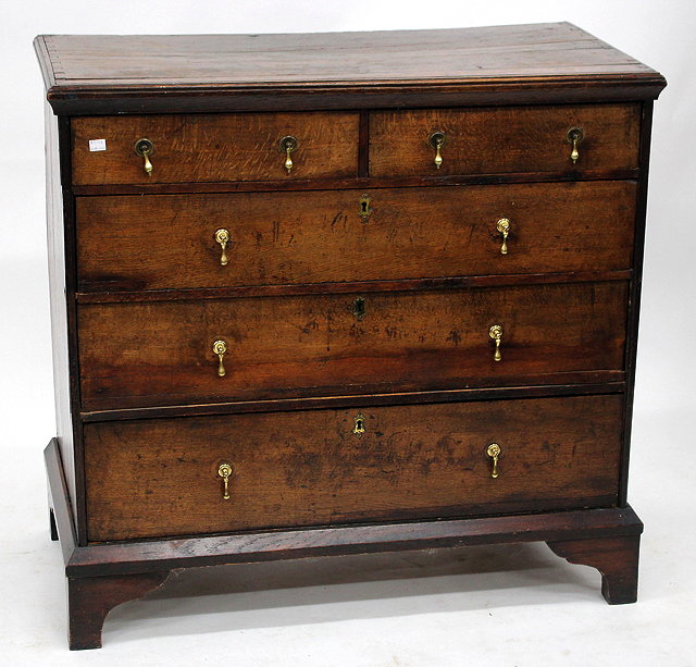 Appraisal: AN ANTIQUE OAK CHEST OF TWO SHORT AND THREE LONG