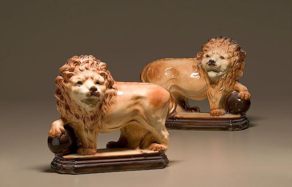 Appraisal: STAFFORDSHIRE STANDING LION MANTEL ORNAMENTS English ca A facing pair