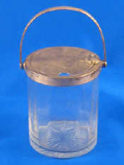 Appraisal: A silver mounted glass jam pot with automatic opening lid