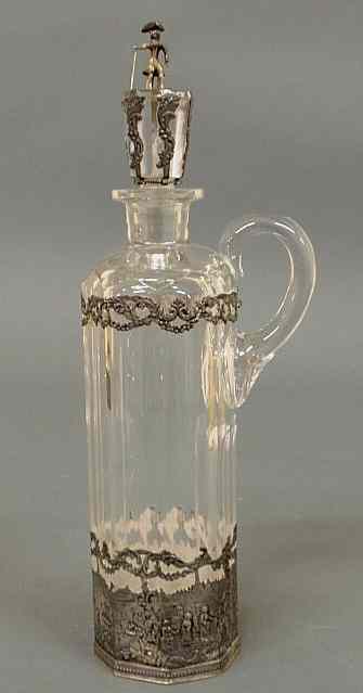 Appraisal: Continental glass and silver overlay claret jug with a lion