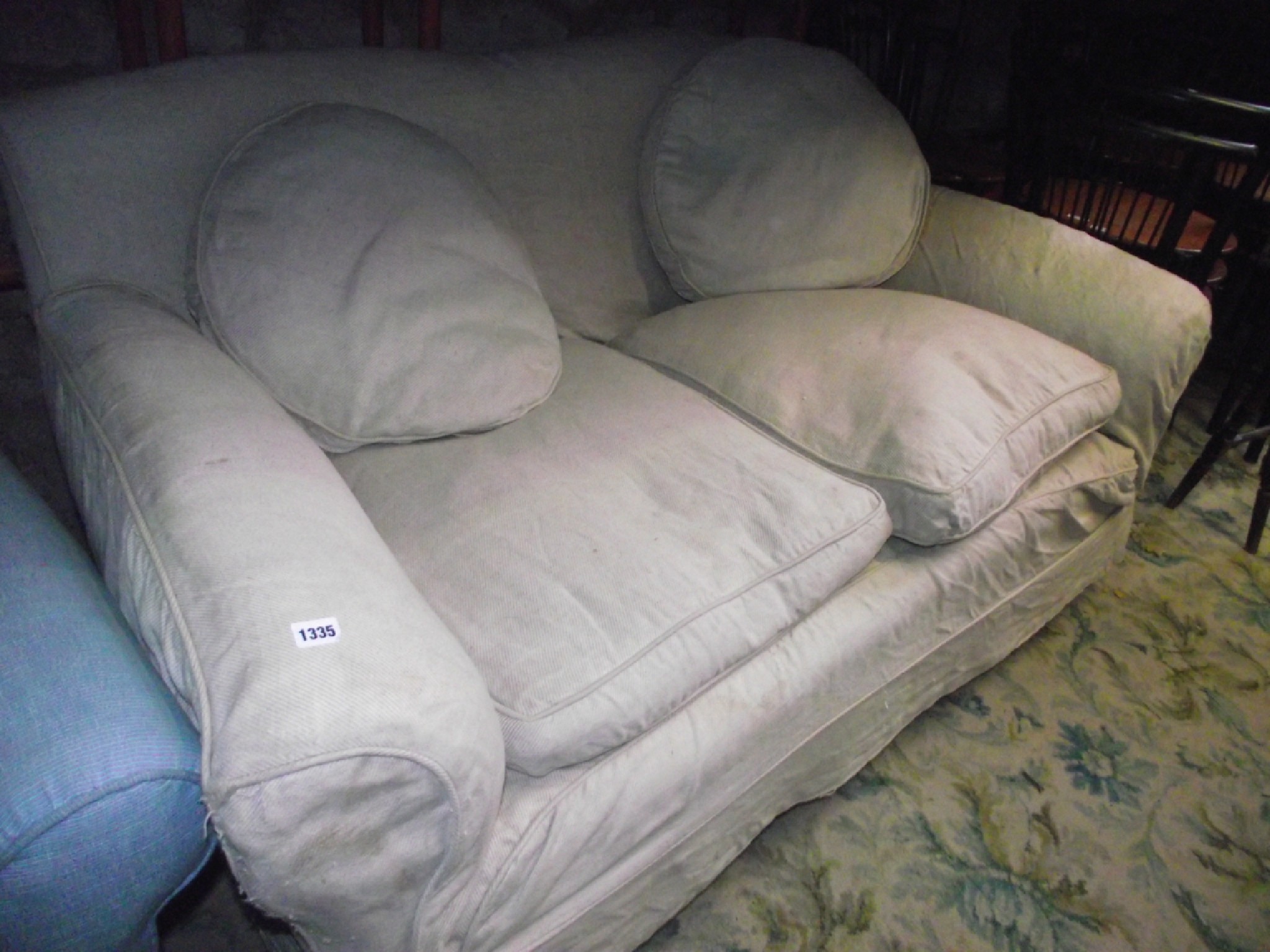 Appraisal: An Edwardian two seat sofa the deep seat flanked by