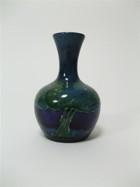 Appraisal: MOORCROFT MINIATURE BOTTLE VASE CIRCA glazed earthenware tube line decoration