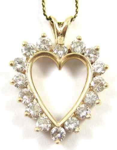 Appraisal: DIAMOND AND FOURTEEN KARAT GOLD PENDANT NECKLACE the open heart