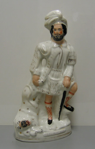 Appraisal: STAFFORDSHIRE POTTERY FIGURE OF SCOTTISH HUNTER Molded as a standing