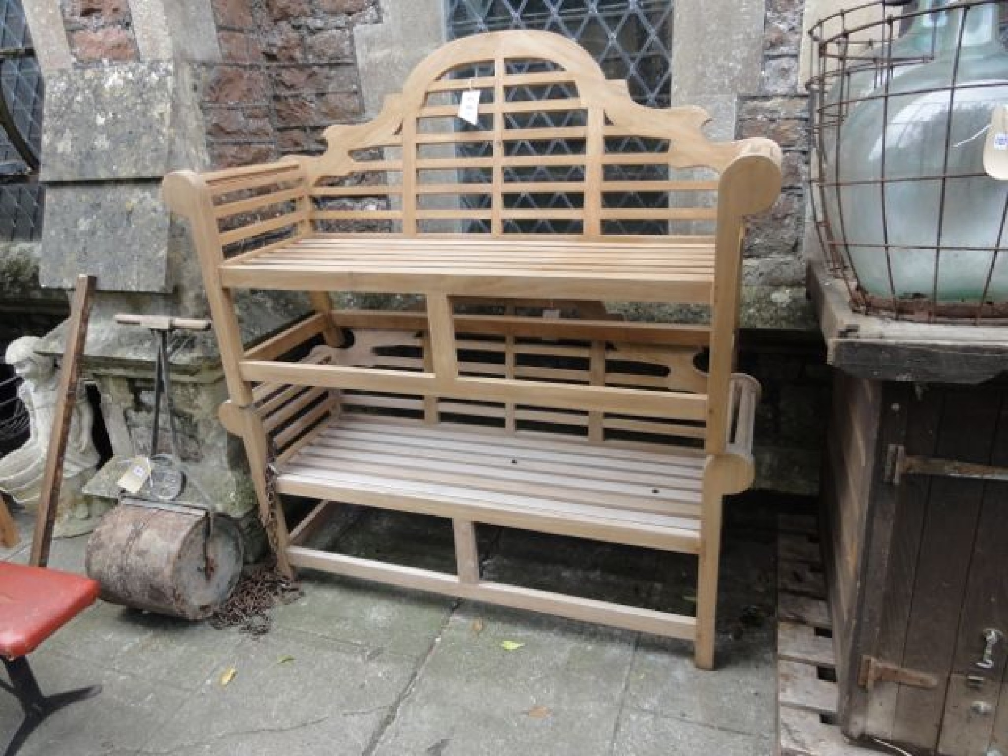 Appraisal: A pair of good quality contemporary three seat garden benches