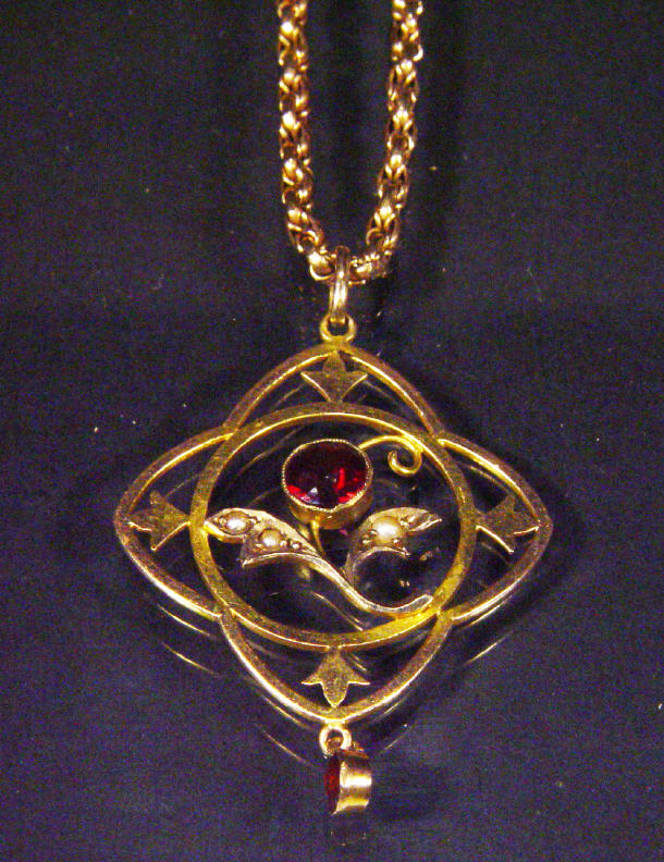 Appraisal: ct gold seed pearl ruby pendant on a ct gold