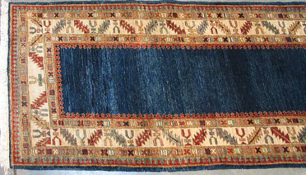 Appraisal: A contemporary Persian runner size approximately ft x ft