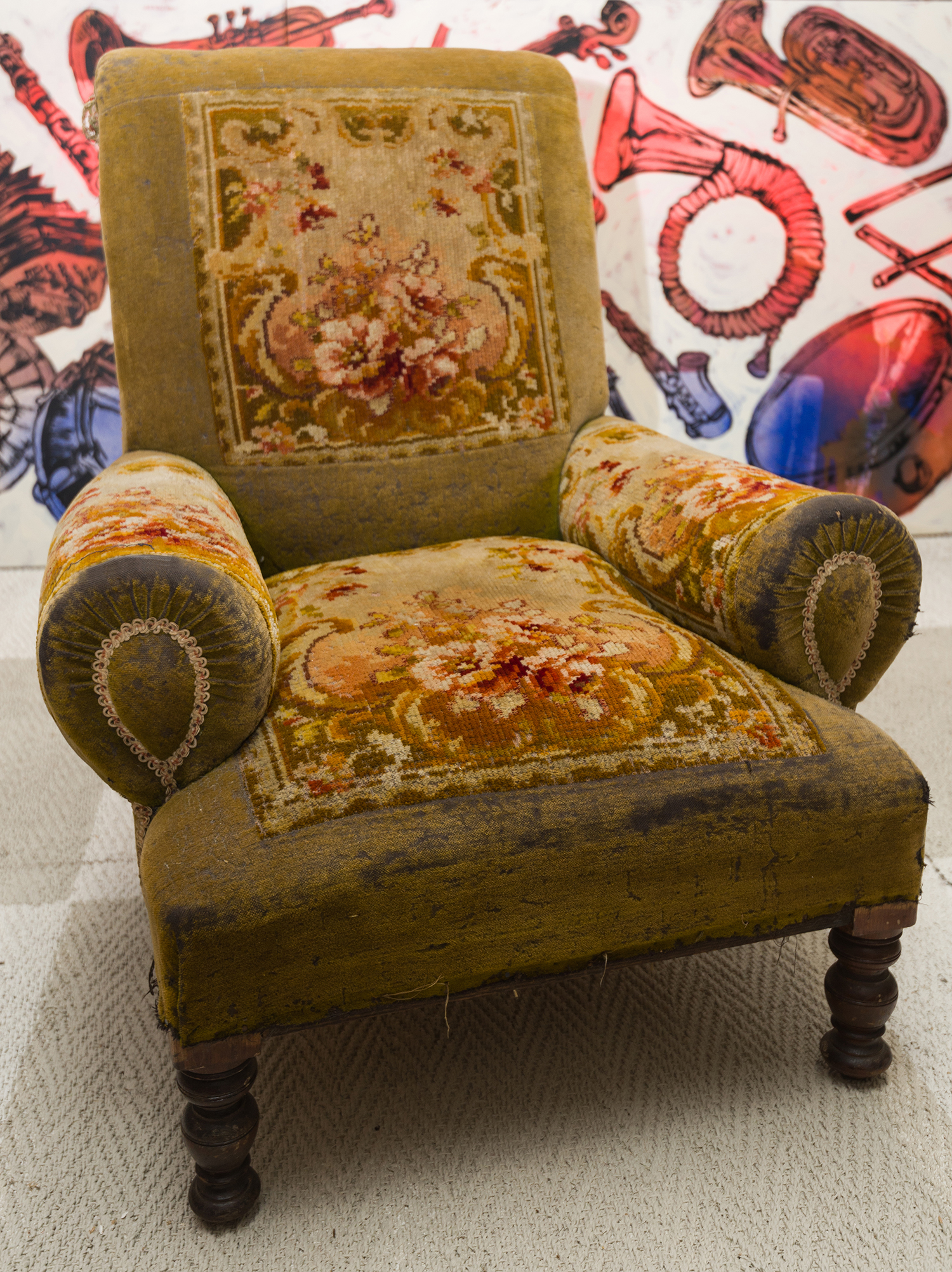 Appraisal: A DISTRESSED LATE TH CENTURY ARMCHAIR WITH FLORAL PATTERENED UPHOLSTERY