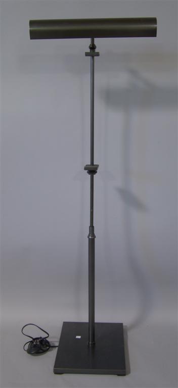 Appraisal: EASEL WITH LAMP Contemporary bronze finish electrified display for holding