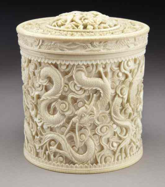 Appraisal: Chinese carved ivory tea caddy depicting dragons International buyers should