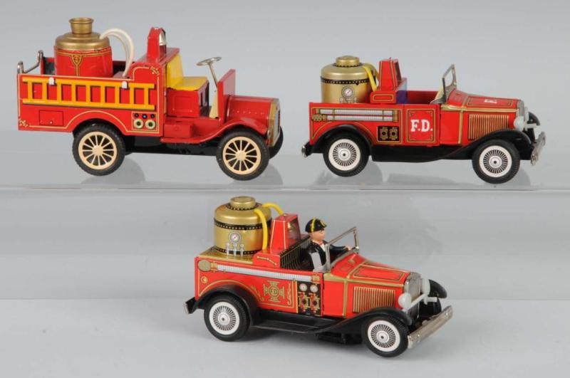 Appraisal: Lot of Tin Fire Pumper Friction Toys Description Japanese Working