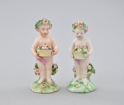 Appraisal: A Pair of Porcelain Figurines of Cherubs with Flower Baskets