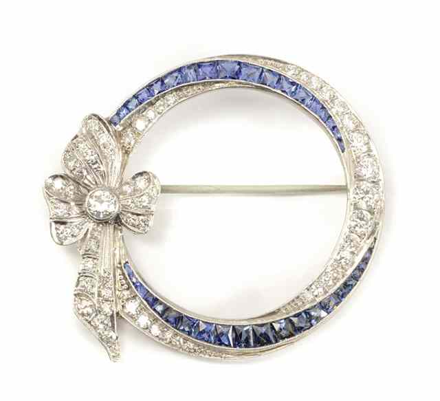 Appraisal: ESTATE SAPPHIRE AND DIAMOND BROOCH The platinum open circle brooch