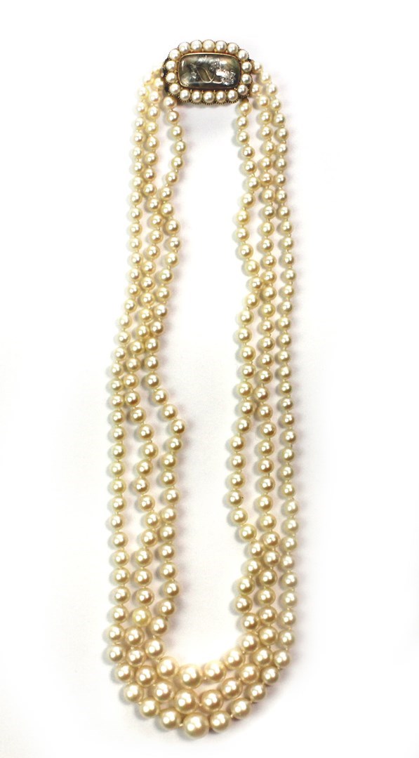 Appraisal: A three row necklace of cultured pearls graduating in size