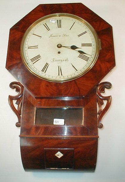 Appraisal: A Victorian flamed mahogany drop dial wall clock with octagonal