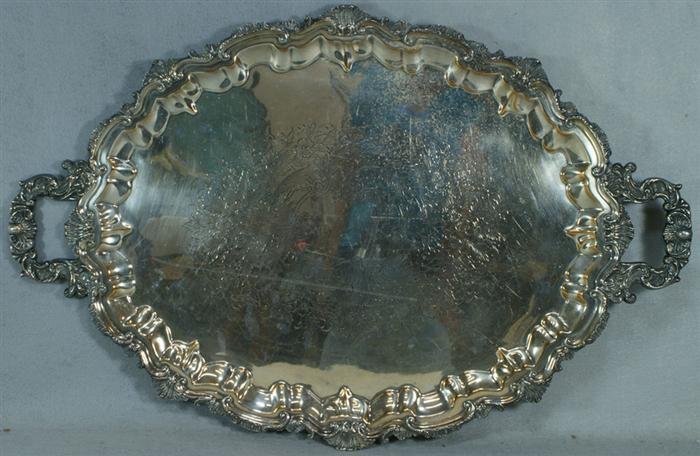 Appraisal: Oval scalloped plated silver handled tray unmarked x Estimate -