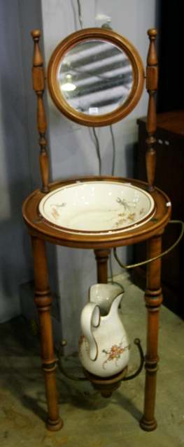 Appraisal: A French oak shaving stand with mirror and faience basin