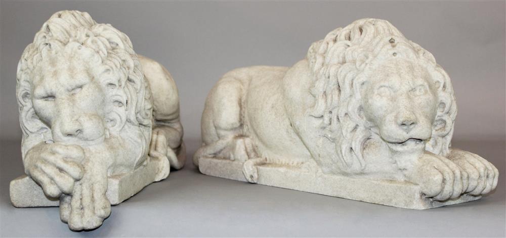 Appraisal: A PAIR OF WHITE MARBLE RECUMBENT LIONS AFTER THE MODEL