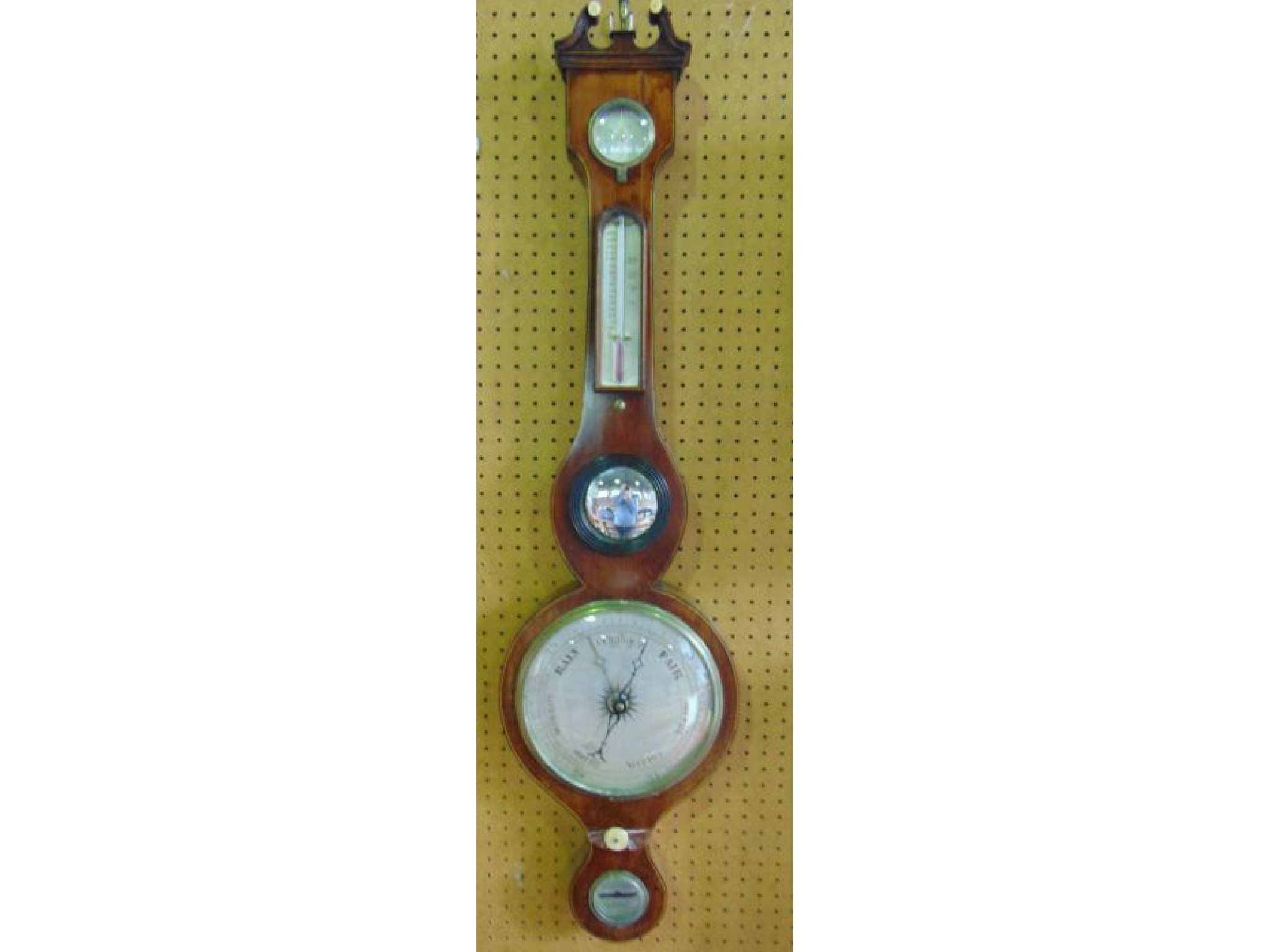 Appraisal: A Georgian mahogany wheel barometer with string banded inlay with