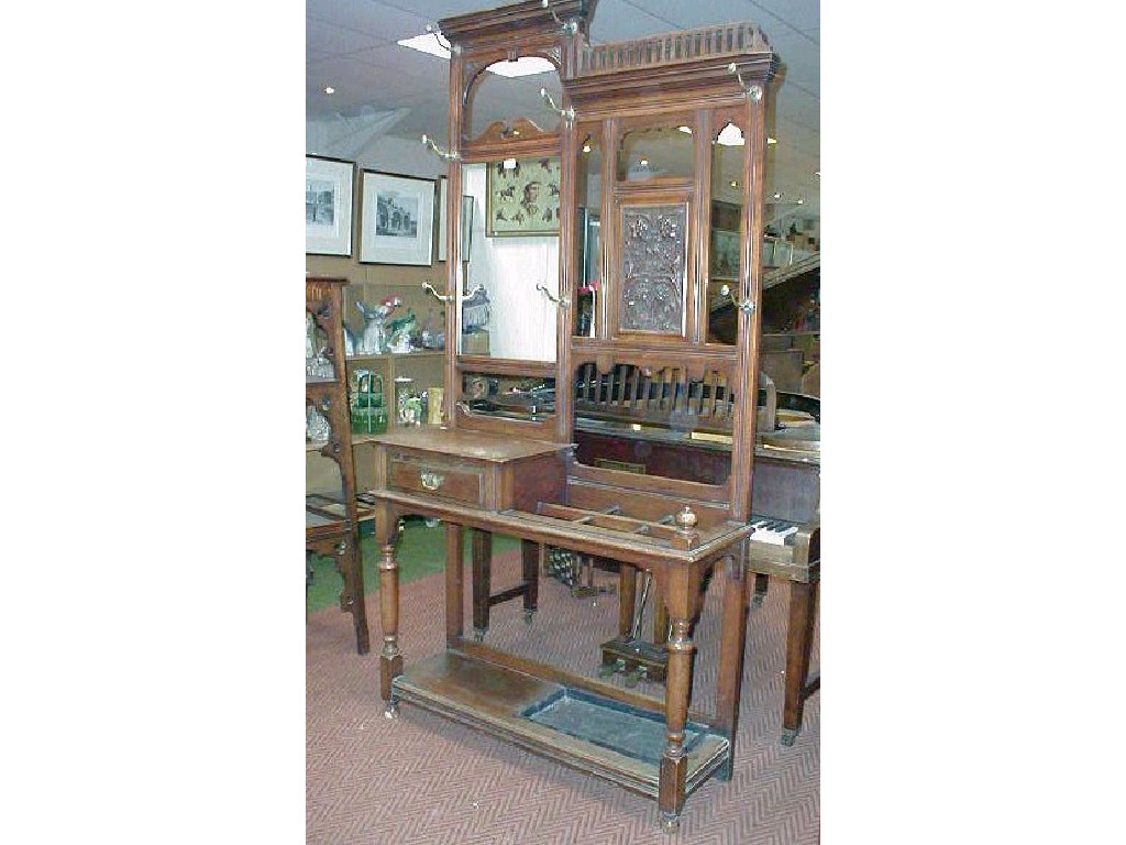 Appraisal: A late Victorian walnut hall stand with a combination of