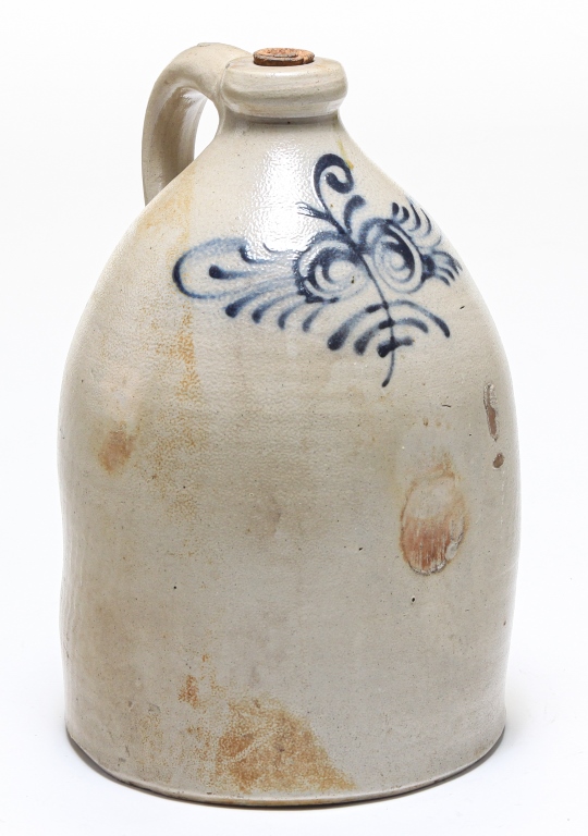 Appraisal: AMERICAN DECORATED STONEWARE JUG Second half th century Strap handle