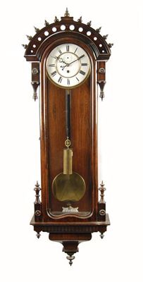 Appraisal: A rosewood veneered and simulated 'Vienna regulator wall clock' with