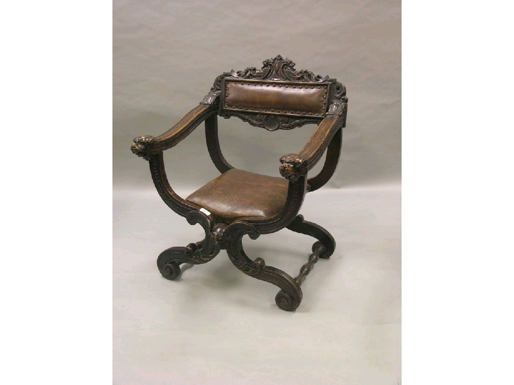 Appraisal: A th century Italian walnut 'X' frame elbow chair griffin